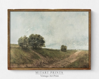 May include: A vintage art print of a landscape painting depicting a dirt road leading through a field with trees on either side. The sky is a light blue with white clouds. The print is framed in a brown wood frame.