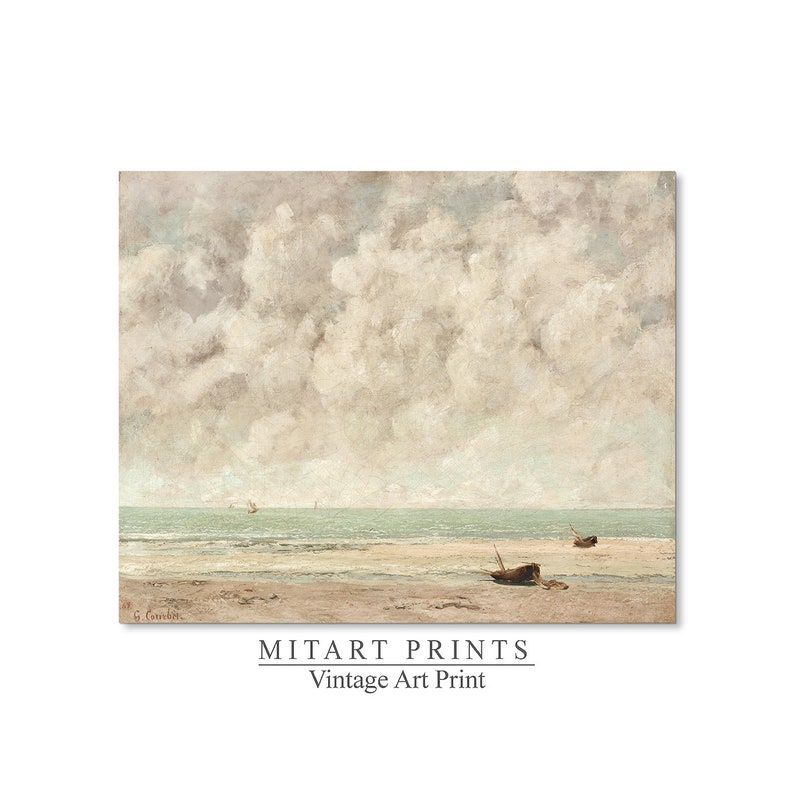 May include: A vintage art print of a seascape with a cloudy sky and a beach with two small boats. The print is in muted tones of blue, gray, and white.