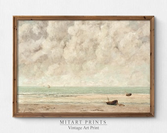 Puede incluir: Una impresión de arte vintage de un paisaje marítimo con un cielo nublado y dos barcos en la playa. La impresión está enmarcada en un marco de madera.