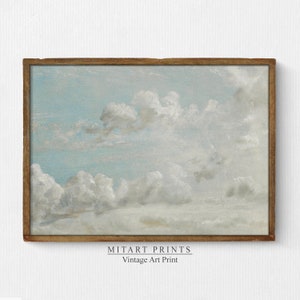 May include: A framed vintage art print of a blue sky with white clouds. The print is titled "MITART PRINTS Vintage Art Print".