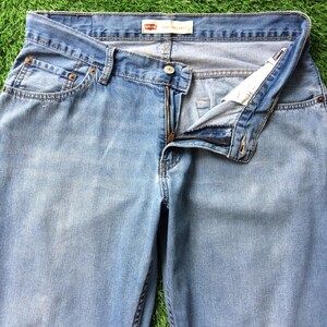 Size 33 Vintage Distressed Levis 550 Jeans W33 L27 Light Wash Denim Classic Relaxed Fit Jeans Waist 33"