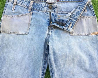Vaqueros acampanados de talle bajo Billabong vintage, con parches, talla W30 L32