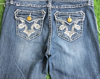Vaqueros Wrangler Rock 47 de corte bota, cintura baja, efecto desgastado, talla W32 L34