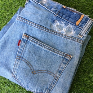 Size 34 Vintage Distressed Levis 550 Jeans W34 L29 Light Wash Denim Relaxed Fit Jeans Made In Egypt Waist 34&quot;
