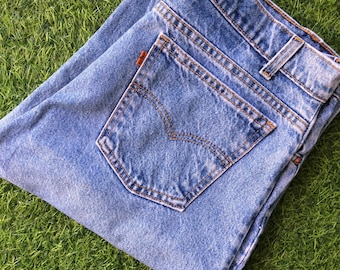 Taille 35 vintage Levi's 550 Jeans W35 L29, jambe fuselée taille haute des années 90, effet vieilli, fabriqué aux États-Unis