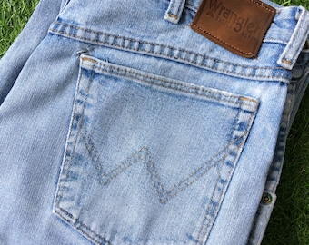 Vaqueros Wrangler vintage, de talle alto y efecto desgastado (W33 L26)