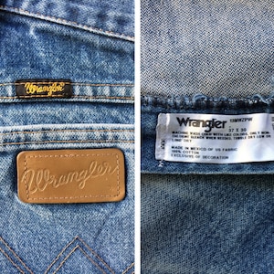 May include: A pair of blue denim jeans with a brown leather Wrangler label on the back pocket. The jeans have a care label that reads "Wrangler 13MWZPW 37 X 30 Machine wash cold with like colours, only non-chlorine bleach when needed, tumble dry low or line dry. Made in Mexico of US fabric 100% cotton exclusive of decoration."