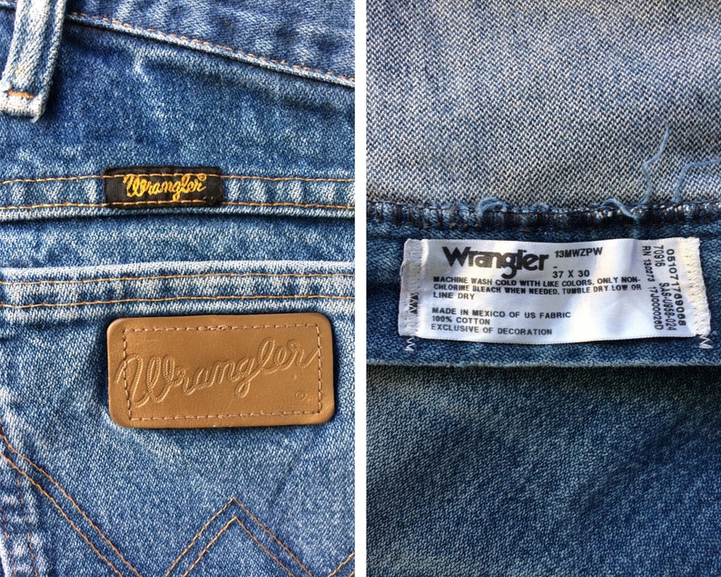 May include: A pair of blue denim jeans with a brown leather Wrangler label on the back pocket. The jeans have a care label that reads "Wrangler 13MWZPW 37 X 30 Machine wash cold with like colours, only non-chlorine bleach when needed, tumble dry low or line dry. Made in Mexico of US fabric 100% cotton exclusive of decoration."