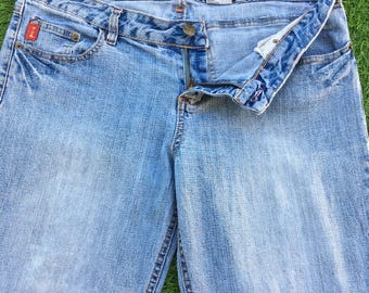 Pantalones vaqueros acampanados Mudd de corte bota, cintura baja, tela vaquera elástica (W33 L30)