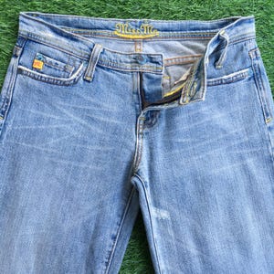 Miss Me light blue wash 2000’s grunge style low-rise embellished embroidered signature rise boot jeans