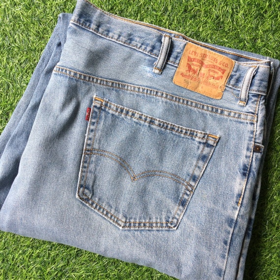 Levis 560 light stonewash jeans discount