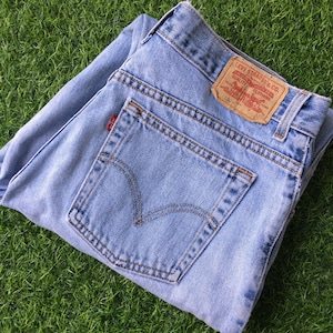 Size 33 Vintage Distressed Levis 550 Jeans W33 L31 Light Wash Rigid Denim Classic Relaxed Fit Tapered Leg Jeans Waist 33"