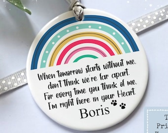May include: White ceramic ornament with a rainbow design and the text "When Tomorrow starts without me, don't think we're far apart. For every time you think of me, I'm right here in your Heart. Boris" and paw prints.