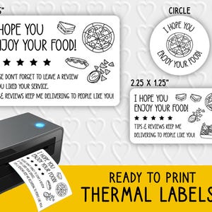 Pode incluir: Etiquetas térmicas em preto e branco com o texto "I HOPE YOU ENJOY YOUR FOOD!" e ilustrações de alimentos. As etiquetas estão disponíveis em formatos retangulares e circulares. Uma impressora térmica também é mostrada.