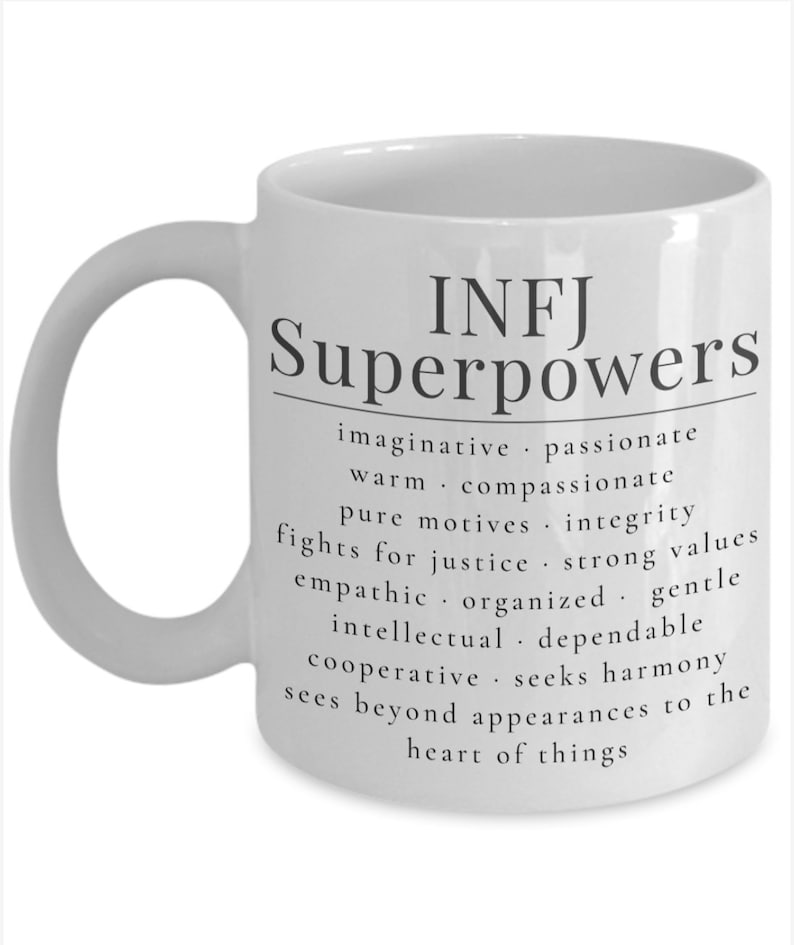 May include: White ceramic mug with a black design that reads "INFJ Superpowers" and lists personality traits associated with the INFJ personality type.