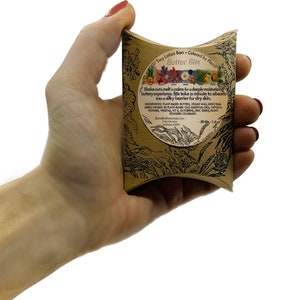 Organic vegan plant-based preservative free lotion bars with essential oils for dry cracked ashy skin in eco-friendly sustainable cardboard box.