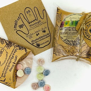Organic preservative free lotion bars butter bits butter buttons with essential oils for dry cracked skin in cardboard kraft dispenser box. reduce reuse recycle