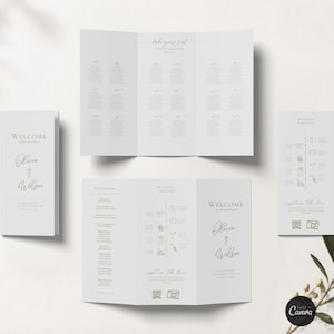 May include: A collection of wedding stationery in a minimalist style. The set includes a welcome sign, a seating chart, and two tri-fold brochures with event details. The text is in a soft gold color on a white background.