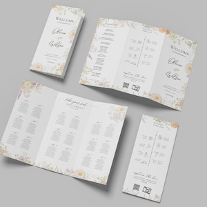 May include: A collection of wedding stationery with floral decorations and the names Olivia & Wilson. The set includes a welcome card, a wedding timeline, and a seating chart. The cards have a soft, pastel colour palette.