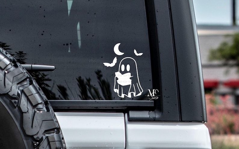 ghost reading vinyl decal sticker. cute spooky sticker. book lover car decal sticker. trending vinyl decal sticker. ghost and bats sticker decal. cute car accessories