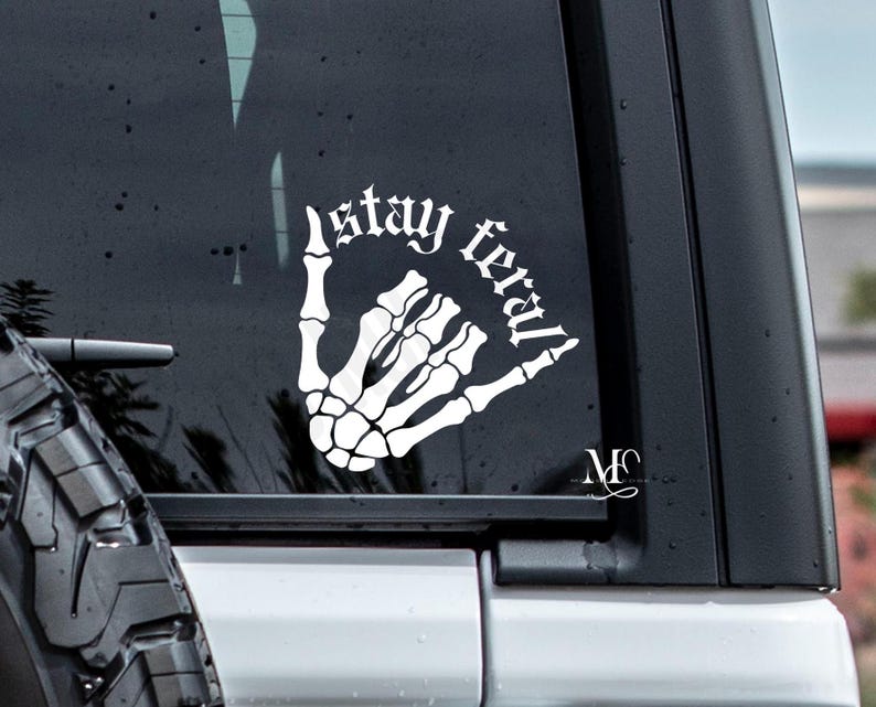 stay feral  skeleton hand vinyl car decal