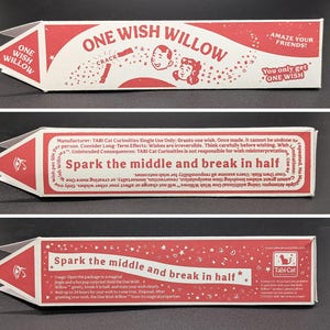 May include: A red and white rectangular paper package labeled One Wish Willow. The packaging features text instructions to spark the middle and break in half, along with illustrations of faces, stars, and an eye symbol on the pointed end.