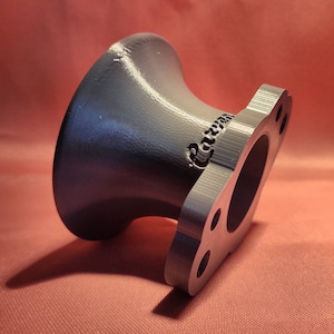 May include: A gray 3D printed intake manifold adapter with the word "Raceware" printed on the side.