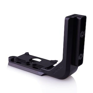 May include: Black L-bracket camera cage with a side plate and the text "LAN-C035E" on the side.