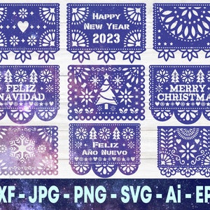 May include: Six blue and white paper cutouts with different holiday greetings. The greetings are "Happy New Year 2023", "Feliz Navidad", "Merry Christmas", "Feliz Año Nuevo", and two with snowflakes.