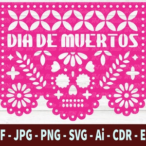 May include: A pink paper cutout with a white design of a skull and flowers. The text "DIA DE MUERTOS" is written in white across the top.