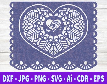 May include: A purple heart-shaped paper cutout with a white intricate design. The design features a smaller heart in the center with a wave-like pattern.