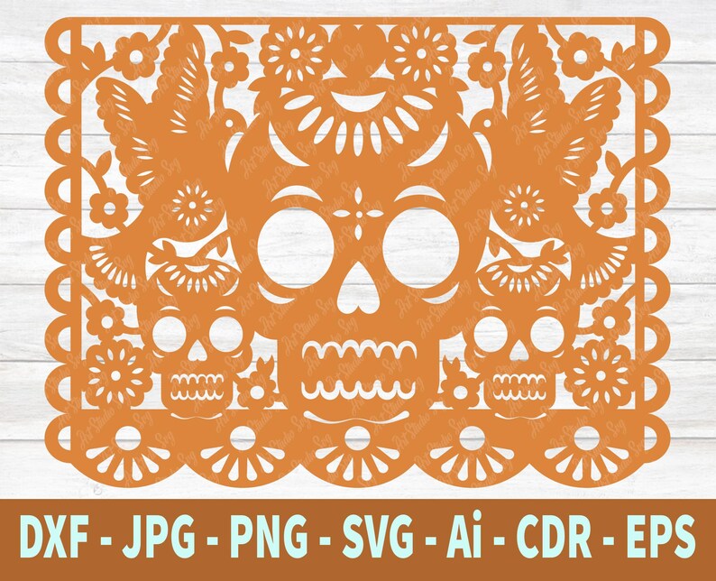 May include: Orange paper cut-out design of a Day of the Dead sugar skull with floral details and two birds. The design is perfect for crafting and decorating.