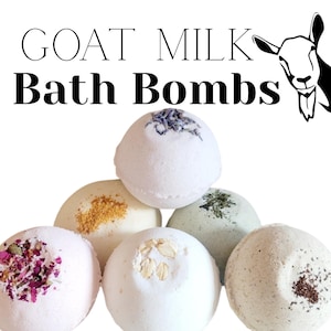 May include: A collection of six goat milk bath bombs, each with a unique topping of dried herbs or flowers. The text "GOAT MILK Bath Bombs" is displayed in black, with a goat illustration in the upper right corner.