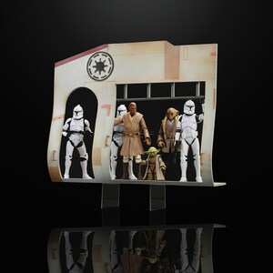 May include: A diorama featuring Star Wars action figures. The scene includes figures of Jedi, clone troopers, and Yoda, set against a backdrop of a beige and white structure with a circular emblem. The figures are posed as if in a scene.