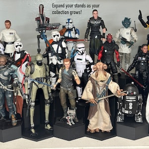 May include: A collection of Star Wars action figures on display stands. The figures include characters such as Darth Vader, Yoda, and Boba Fett. The figures are all in different poses and are displayed on black hexagonal stands. The text "Expand your stands as your collection grows!" is written at the top of the image.