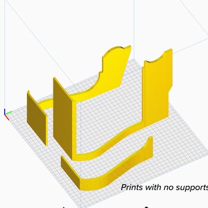 May include: A 3D-rendered yellow model of a chair, disassembled into several parts. The components include the back, seat, and side supports, arranged on a grid. Text at the bottom reads "Prints with no supports!"