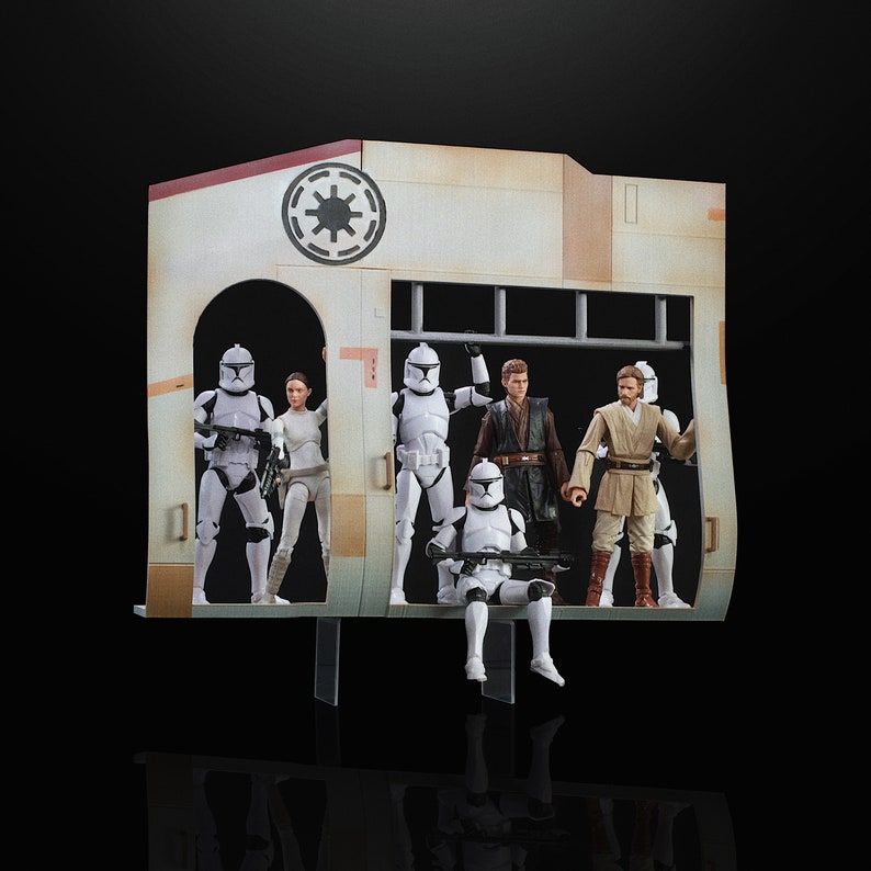 May include: A diorama featuring Star Wars action figures. The scene includes figures of clone troopers, Anakin Skywalker, and Obi-Wan Kenobi. The backdrop is a tan and white structure with a circular emblem.