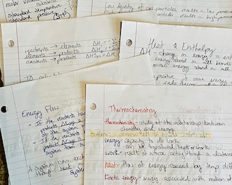 May include: A collection of handwritten notes on lined paper, detailing chemistry concepts. The notes, in black, blue, and red ink, cover topics like molar volume, pressure, energy flow, and thermochemistry. The papers are scattered, creating a study-focused aesthetic.