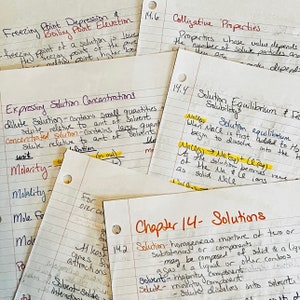 May include: A collection of handwritten notes on lined paper, with various chemistry concepts and equations. Topics include freezing point depression, solution concentrations, and colligative properties. The notes are highlighted with yellow markers.