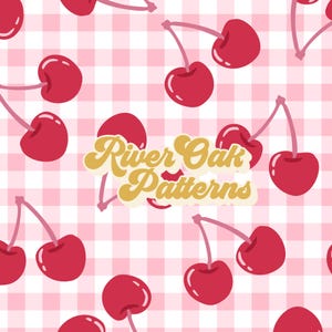 May include: A seamless pattern featuring red cherries on a pink and white gingham background. The text "River Oak Patterns" is in the centre of the image in a gold, retro font.