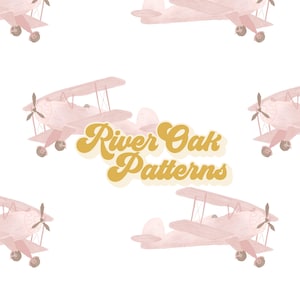 May include: A seamless pattern featuring pink watercolor airplanes on a white background. The text "River Oak Patterns" is written in a retro font in gold.