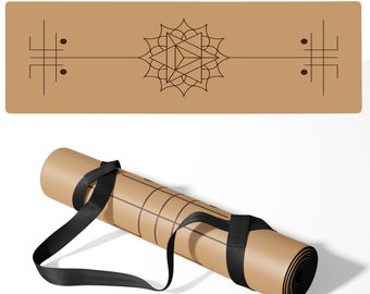 May include: A rolled-up brown yoga mat with a black strap and a geometric design. The mat is unfurled in the background, showing a brown background with a black geometric design.