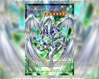 May include: A rectangular trading card featuring a white dragon with large wings and purple accents against a green and blue cosmic background. The text reads FAN-MADE CUSTOM ART PROXY, STARDUST DRAGON, DRAGON/SYNCRO/EFFECT, ATK/2500 DEF/2000, and NOT AN OFFICIAL TRADING CARD.
