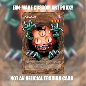 Pode incluir: Uma carta colecionável personalizada de Sangan com uma criatura redonda, laranja e de três olhos, com braços de garras verdes e dentes afiados. A carta exibe o texto Sangan, Fiend/Effect, ATK/1000, DEF/600 e Fan-made custom art proxy.