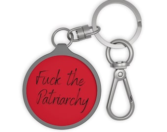 F the Patriarchy Key Chain on the ground