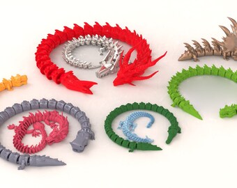 May include: A set of eight articulated dragon figurines in various colors, including red, green, blue, gray, and orange. The dragons are made of plastic and have a segmented body.