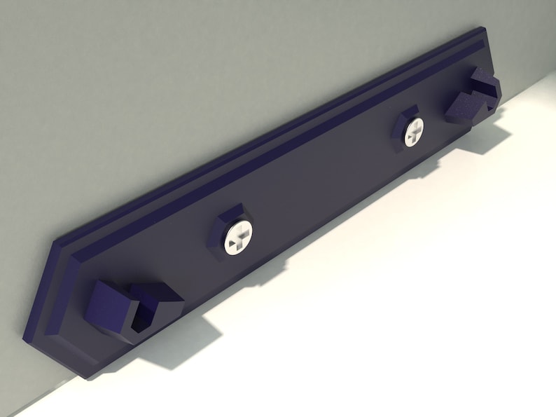 May include: A dark blue metal shelf bracket with two screw holes and two mounting tabs. The bracket is mounted to a wall.
