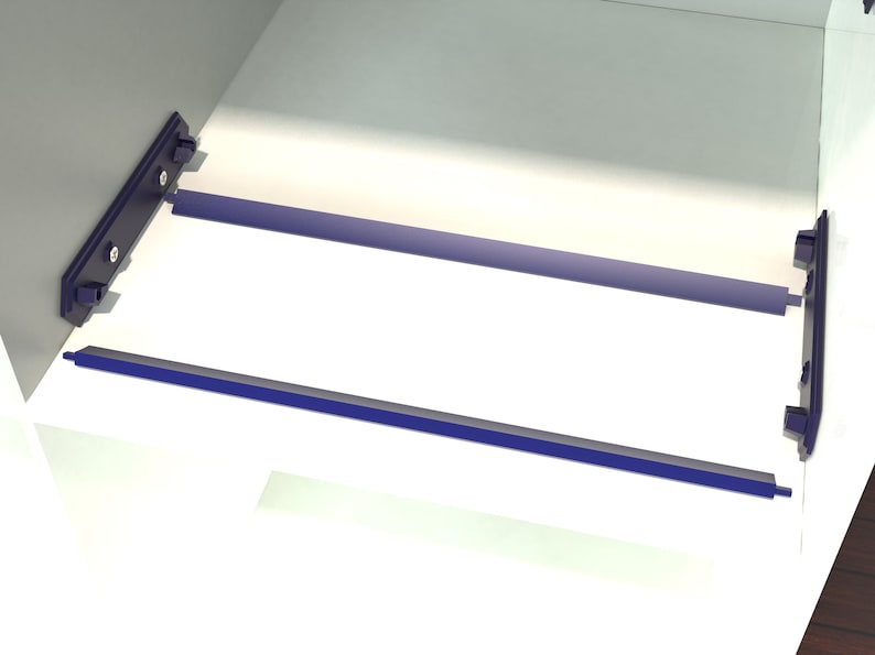 May include: Close-up of a white cabinet with two blue metal shelf supports. The supports are attached to the cabinet with screws.