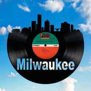 May include: A black vinyl record with a cityscape silhouette of Milwaukee, Wisconsin. The record label is red, green, and white with the text "The Lennie Tristano Quartet" and "Atlantic" in black.