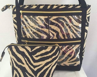 May include: A black and tan zebra print tote bag with clear zippered pockets and a matching smaller zippered pouch.